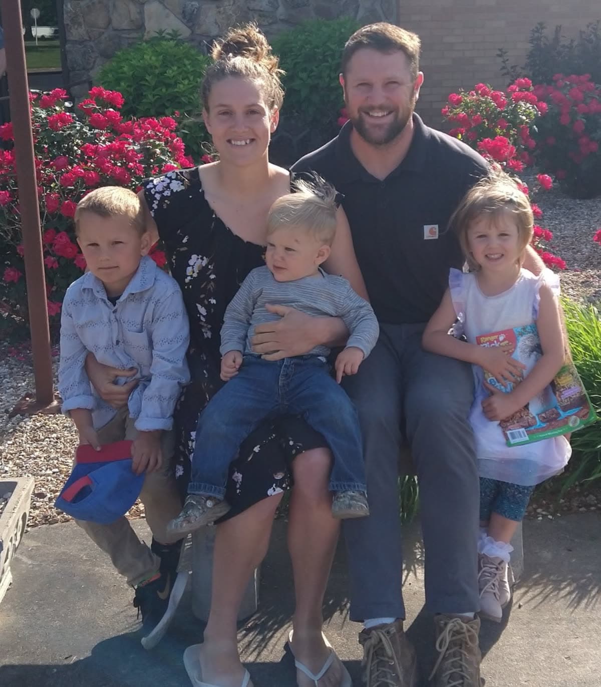 The Leonard family together outdoors: Kyle, Elizabeth, and their three children